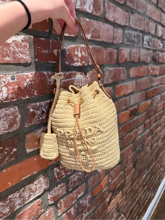 Prada Handbags - Prada Beige Straw Crochet Bucket Bag with Tan Leather Trim